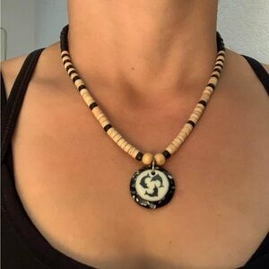 Tribal-Inspired Wooden Bead Necklace with Dolphin Pendant